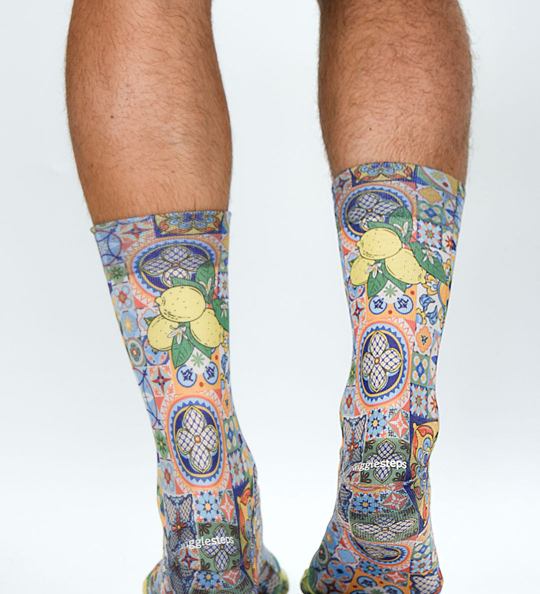 Colorful patterned socks with lemons on a white background