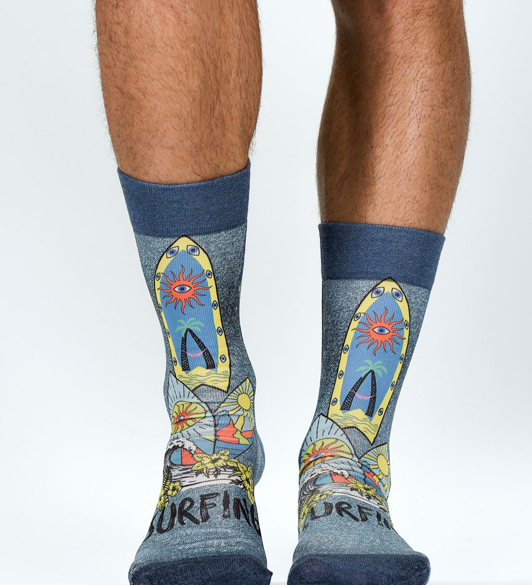 Colorful socks with surfboard design worn by a person on a white background
