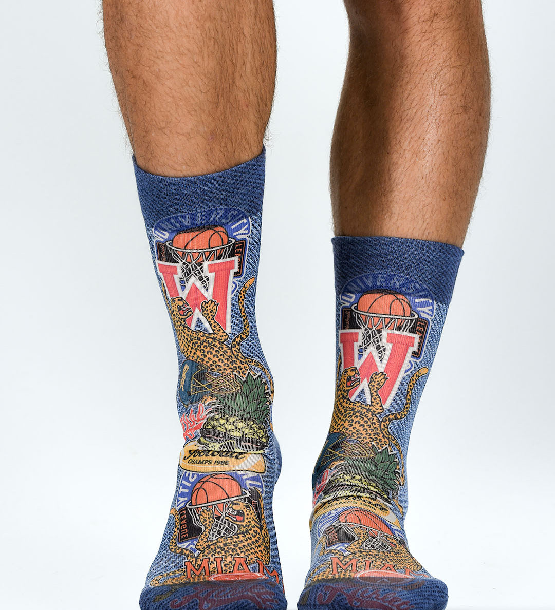 Colorful socks with sports-themed design on a white background