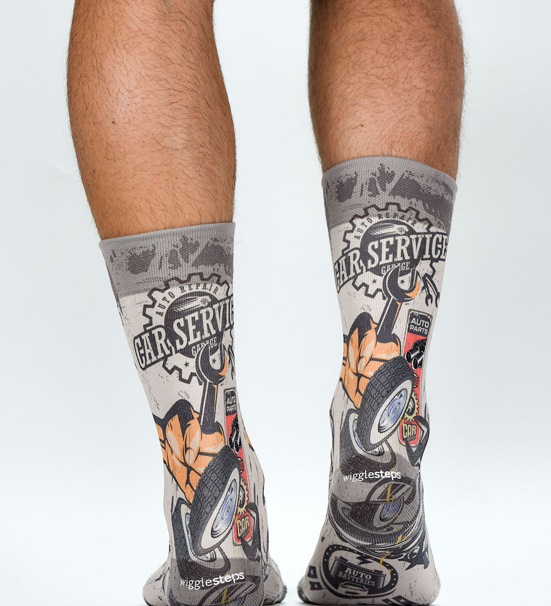 Gray socks with car service design worn by a person on a white background