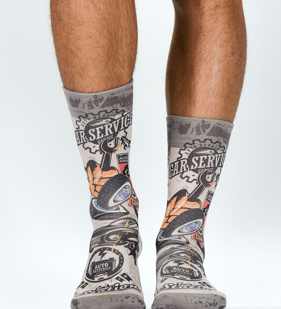 Gray socks with mechanical design worn by a person on a white background