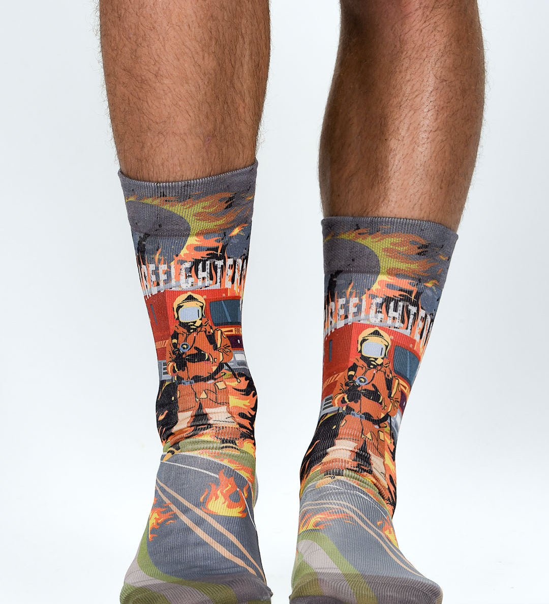 Firefighter-themed socks with a person wearing them on a white background