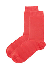 Pair of red dress socks on a white background