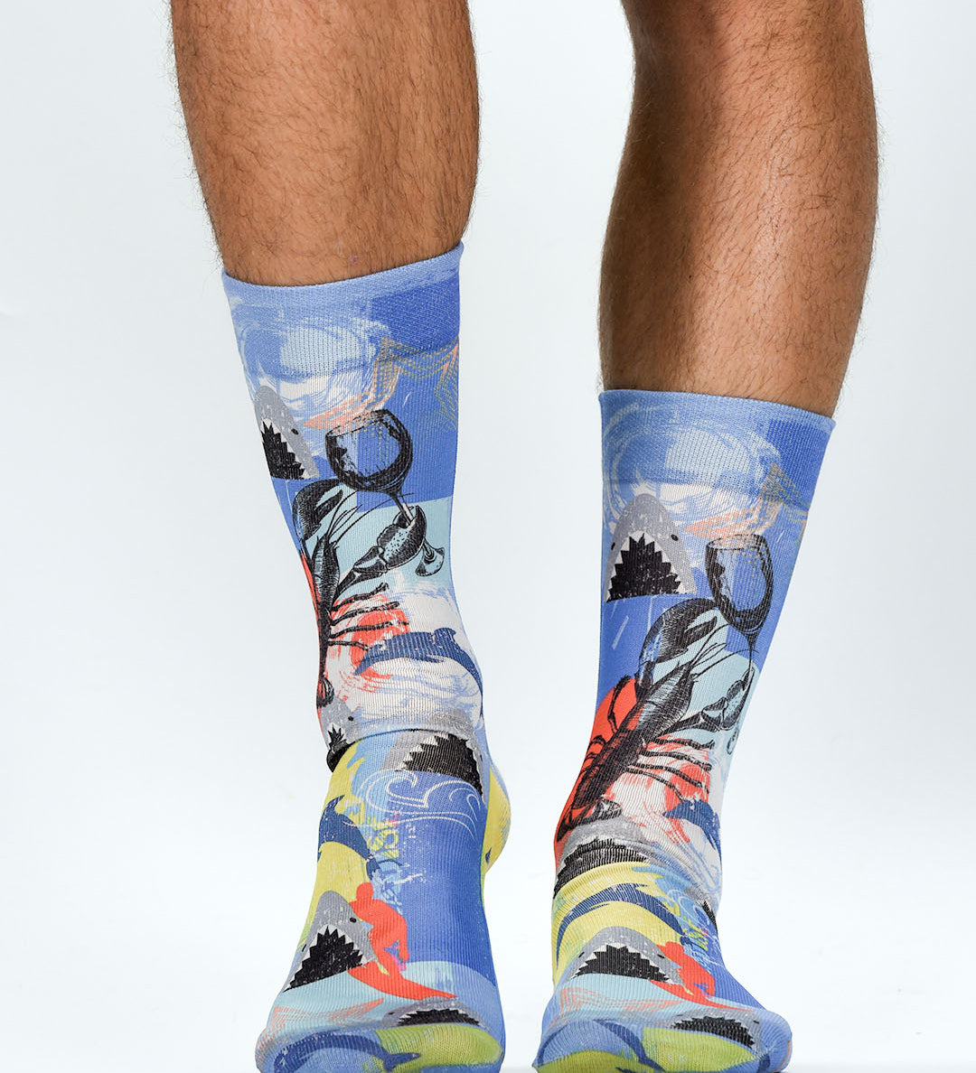 Colorful socks with a design of a person holding a flag on a white background