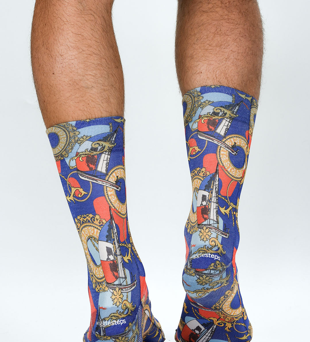 Colorful socks with a pattern of clocks and other objects on a white background