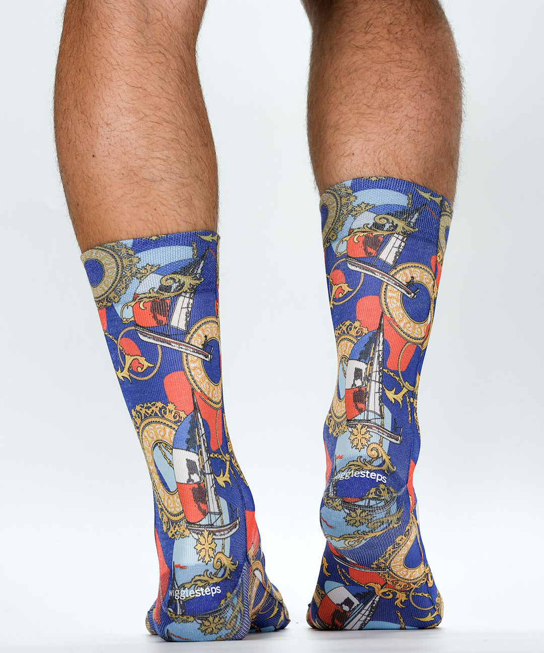 Colorful socks with a pattern of clocks and other objects on a white background