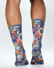 Colorful socks with a pattern of clocks and other objects on a white background