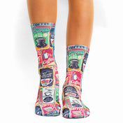 Colorful coffee-themed socks worn by a person on a white background