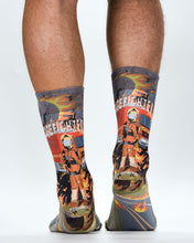 Colorful socks with firefighter design worn by a person on a white background
