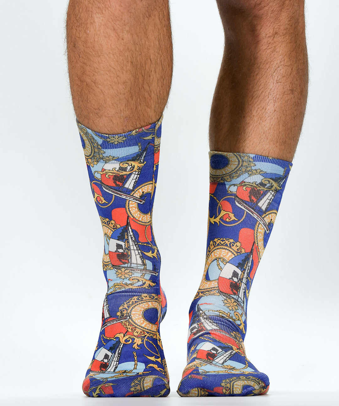 Colorful patterned socks worn by a person on a white background