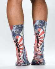 Colorful socks with vintage-style designs on a white background