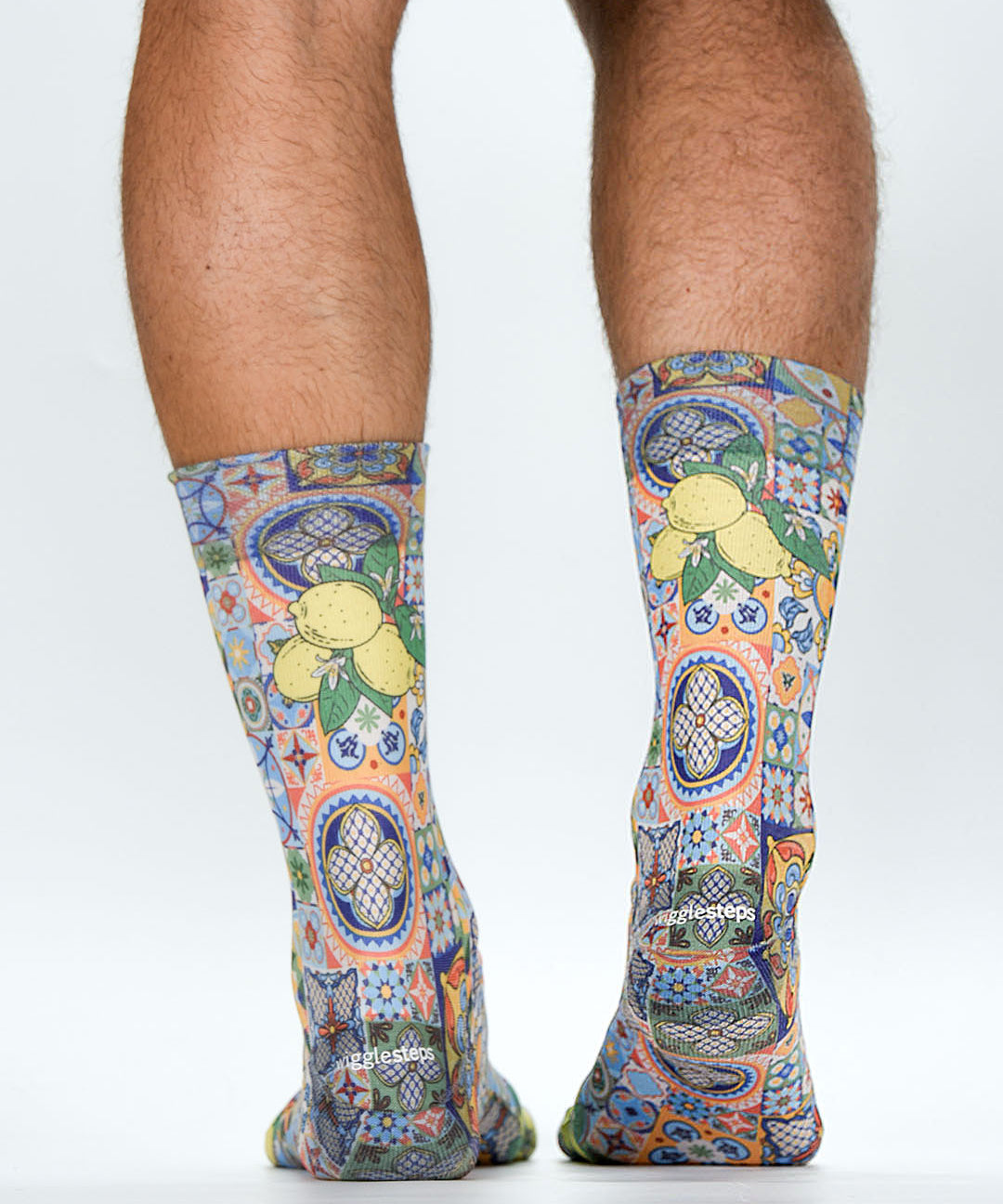 Colorful patterned socks with lemons on a white background