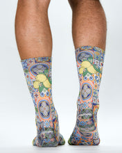 Colorful patterned socks with lemons on a white background