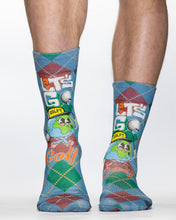 Colorful socks with golf-themed design worn by a person on a white background