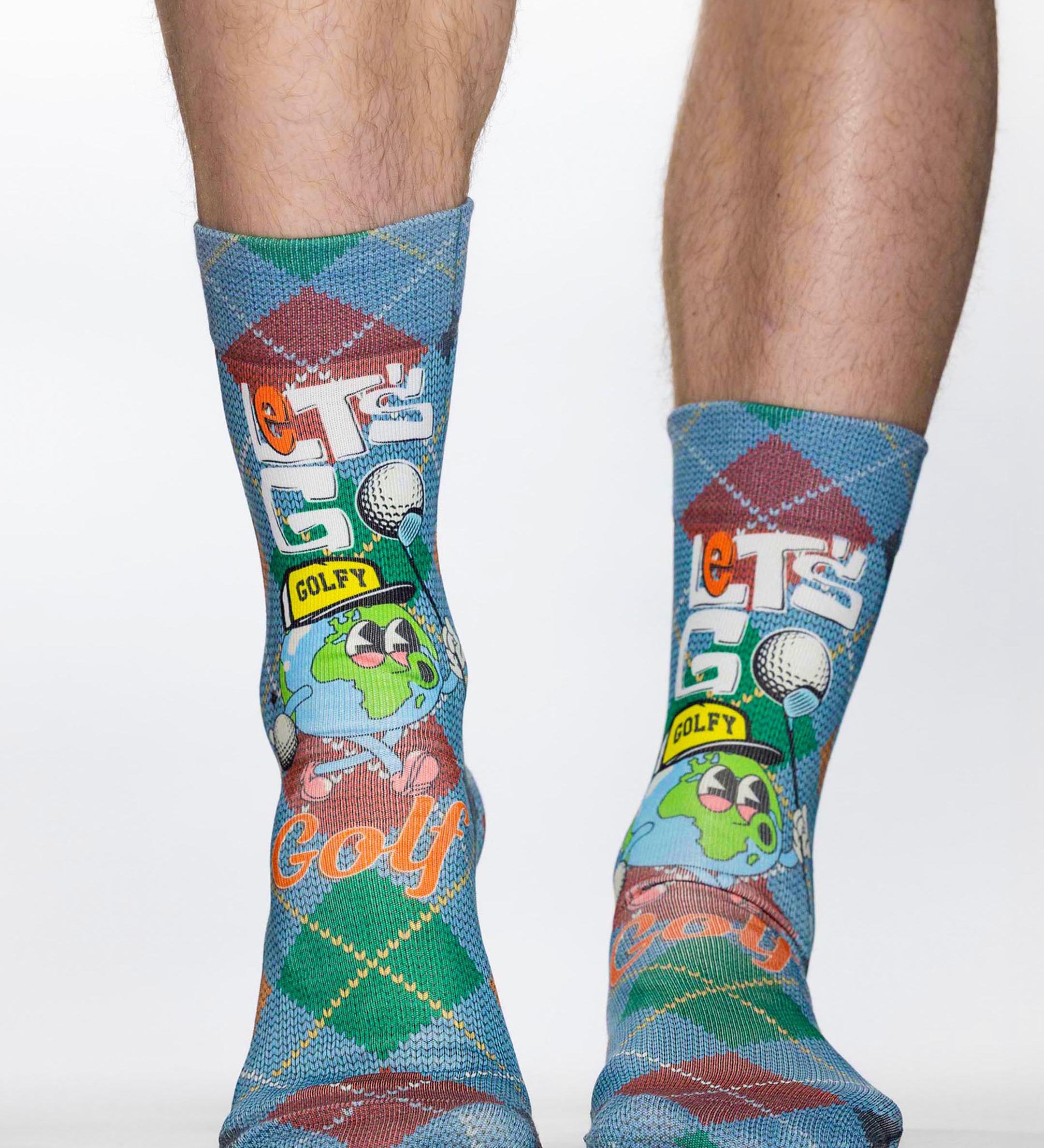 Colorful socks with golf-themed design worn by a person on a white background