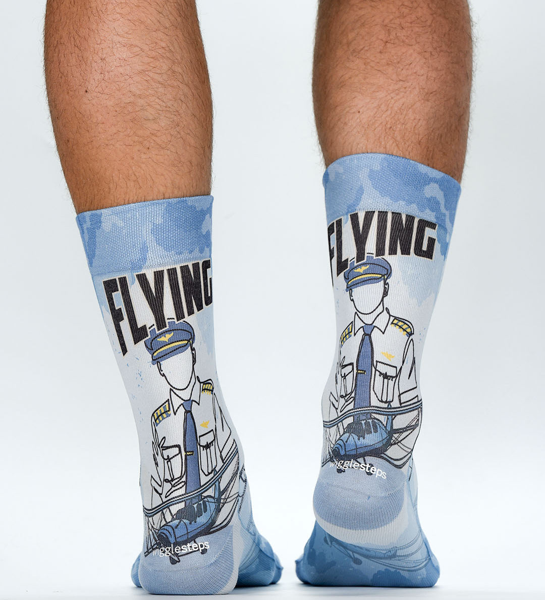 Pilot-themed socks with 'Flying' text worn by a person on a white background