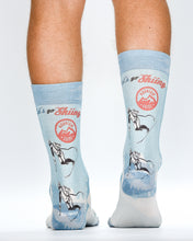 Light blue socks with skiing design and 'Go Skiing' text on a white background