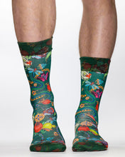 Colorful patterned socks worn by a person on a white background