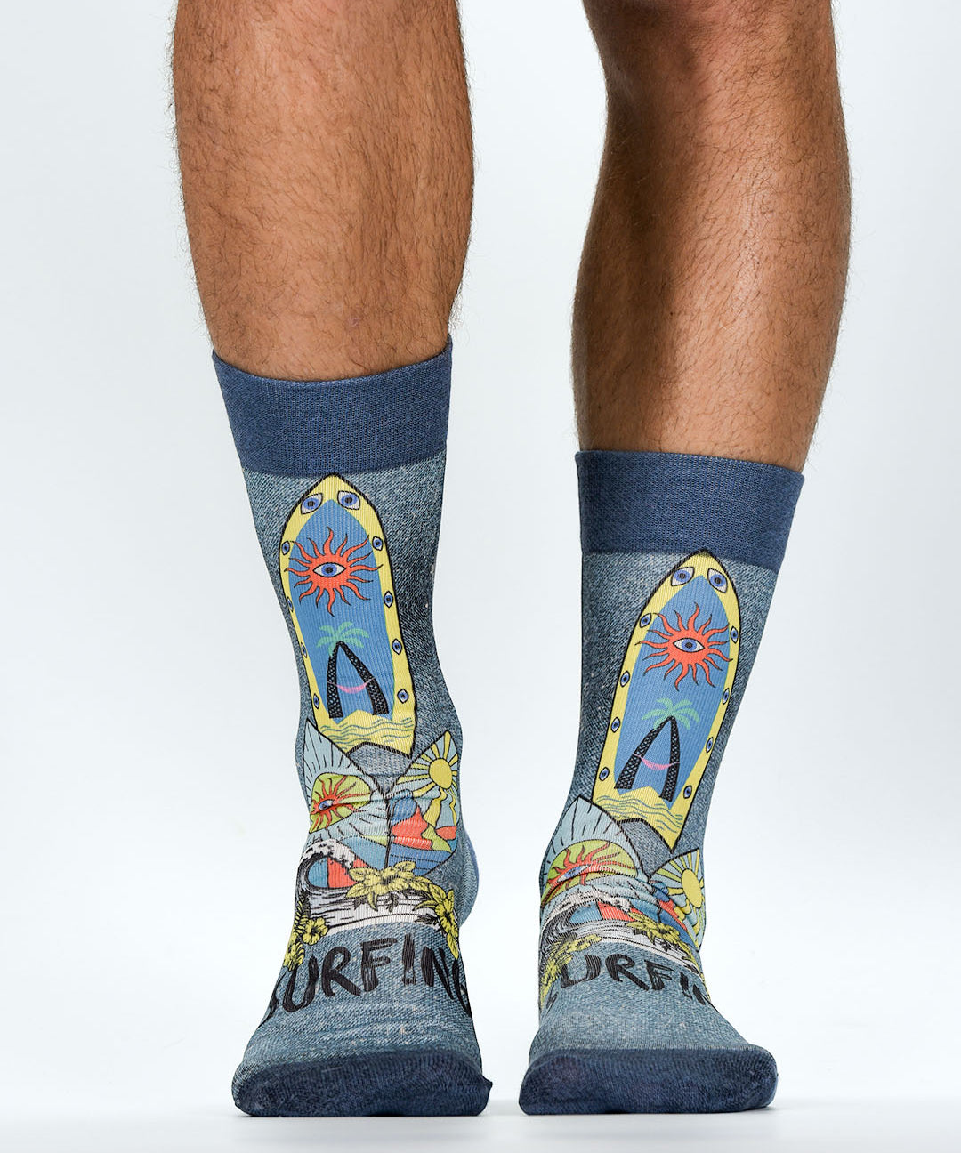 Colorful socks with surfboard design worn by a person on a white background
