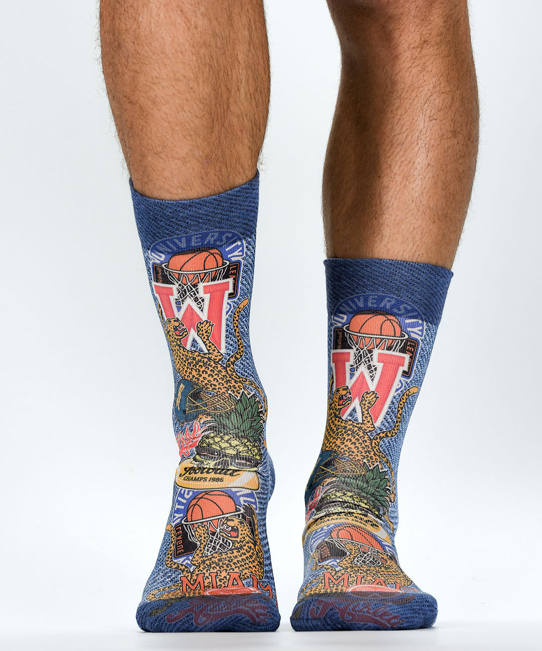 Colorful socks with sports-themed design on a white background
