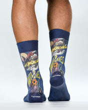Navy socks with shark and surf design worn by a person on a white background