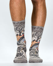 Gray socks with mechanical design worn by a person on a white background