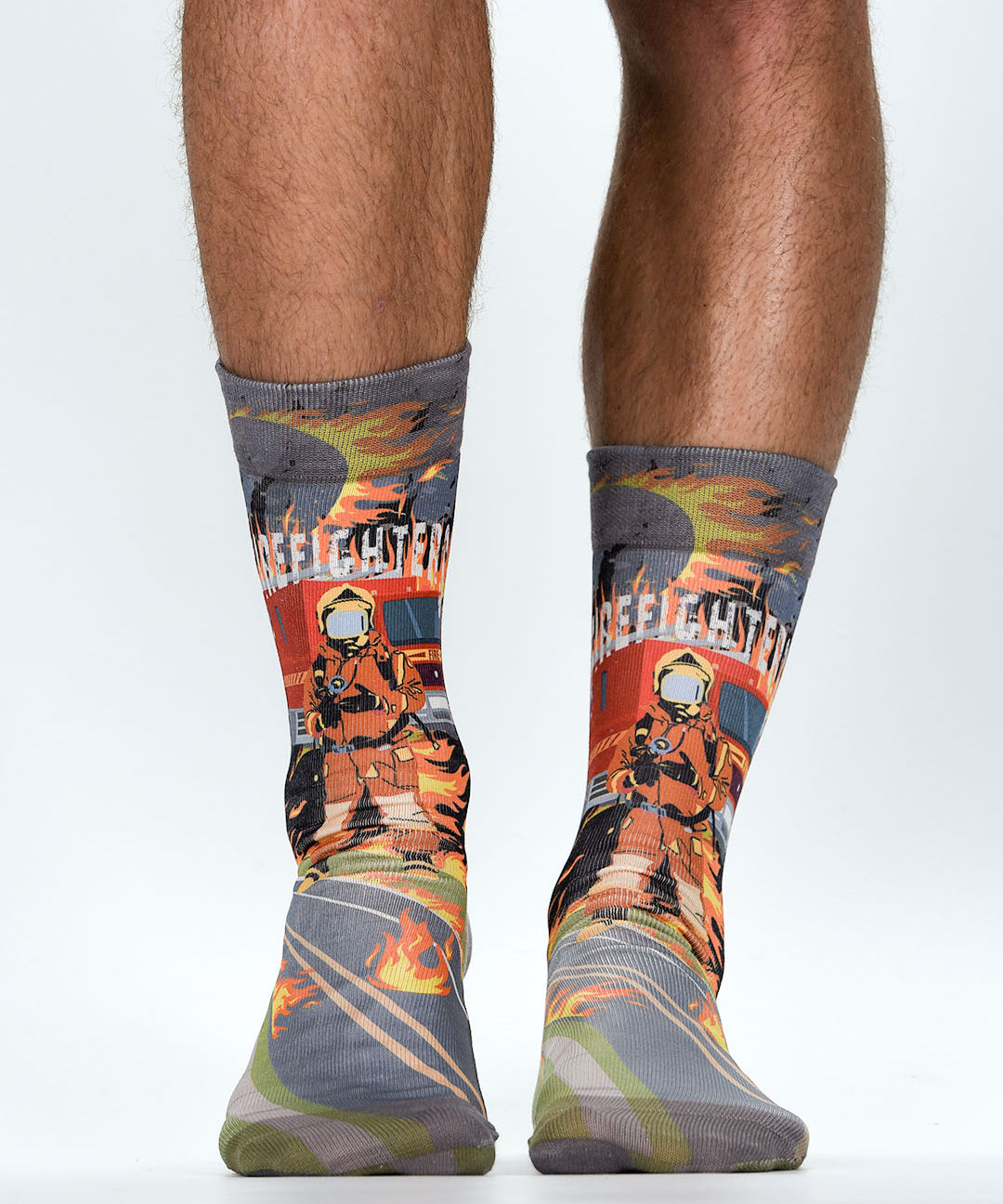 Firefighter-themed socks with a person wearing them on a white background