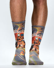 Firefighter-themed socks with a person wearing them on a white background