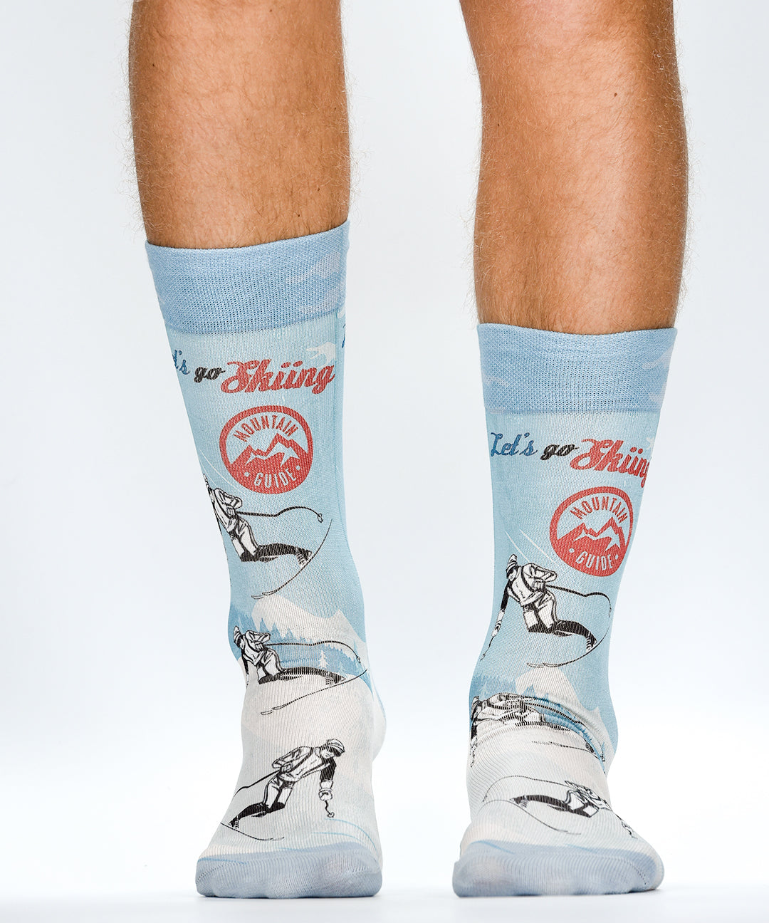 Light blue socks with graphic designs and text on a white background